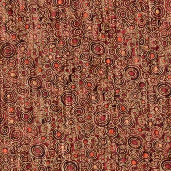 Tissu coton patchwork motifs tourbillons stylisés orange et brun, idéal pour accessoires d'automne, disponible chez Mille et Un Tissus à Moulins.