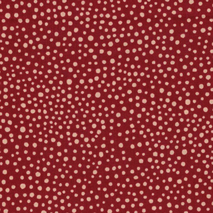 Tissu en coton rouge à petits pois blancs classiques, un indispensable pour toutes vos créations couture, disponible chez Mille et Un Tissus à Moulins.