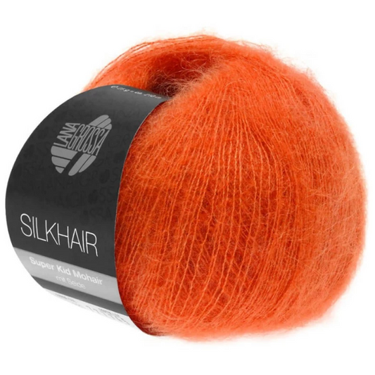 Pelote de laine mohair unie Silkhair Lana Grossa coloris 136 orange vif, fil fin et soyeux de haute qualité, disponible chez Mille et Un Tissus à Moulins.